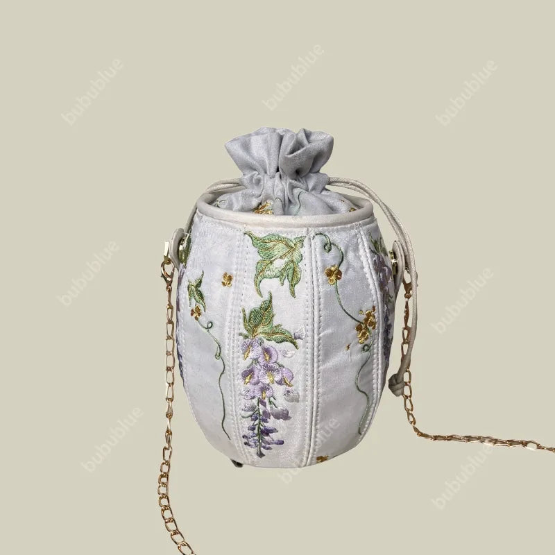 Wisteria Embroidered Drawstring Bucket Bag in Cream Satin