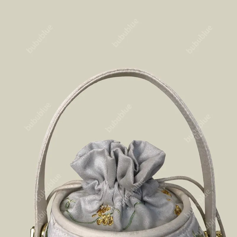 Wisteria Embroidered Drawstring Bucket Bag in Cream Satin