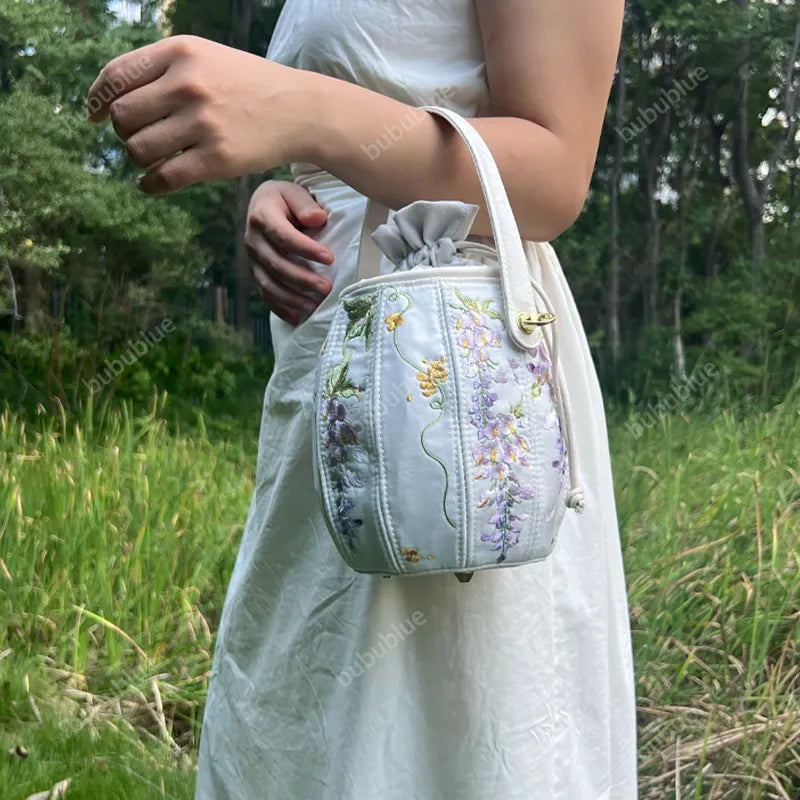 Wisteria Embroidered Drawstring Bucket Bag in Cream Satin