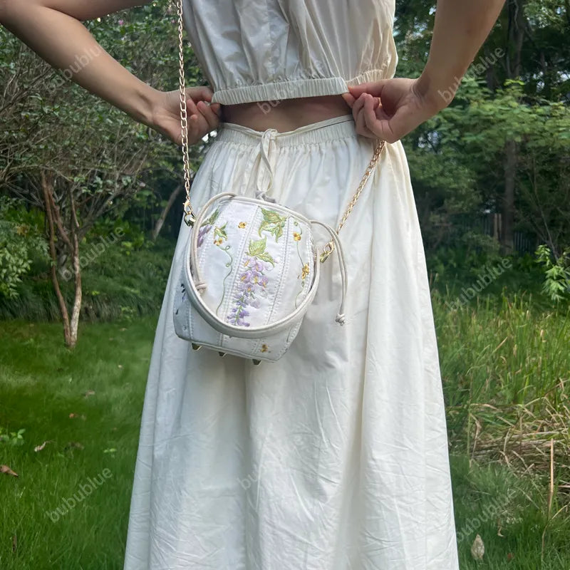 Wisteria Embroidered Drawstring Bucket Bag in Cream Satin