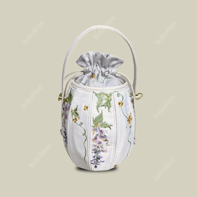 Wisteria Embroidered Drawstring Bucket Bag in Cream Satin