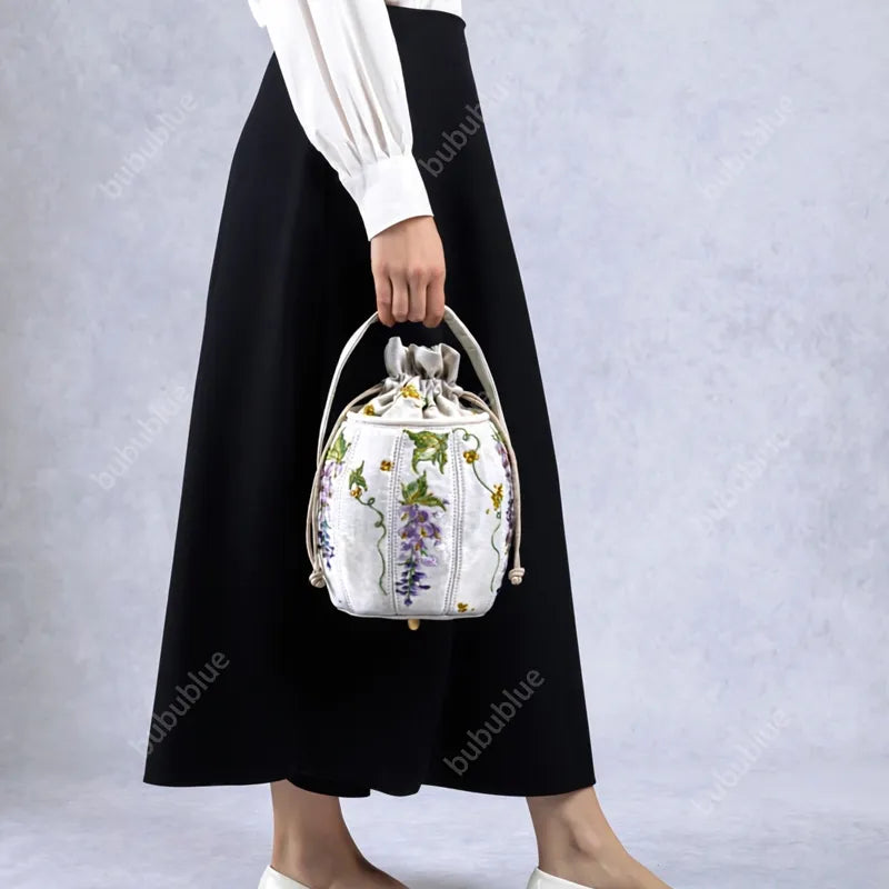 Wisteria Embroidered Drawstring Bucket Bag in Cream Satin