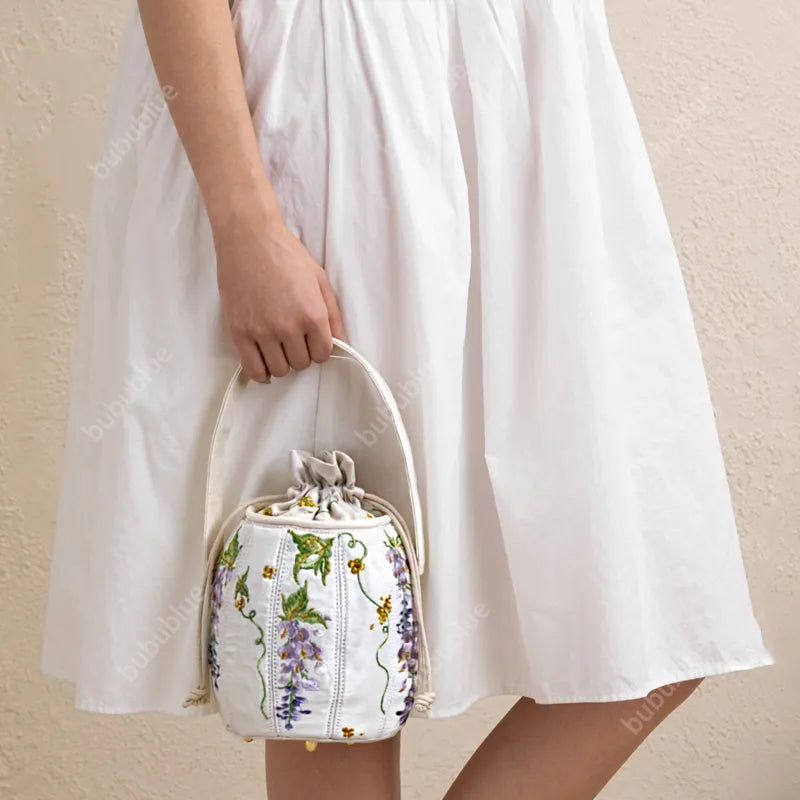 Wisteria Embroidered Drawstring Bucket Bag in Cream Satin