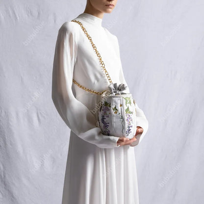 Wisteria Embroidered Drawstring Bucket Bag in Cream Satin