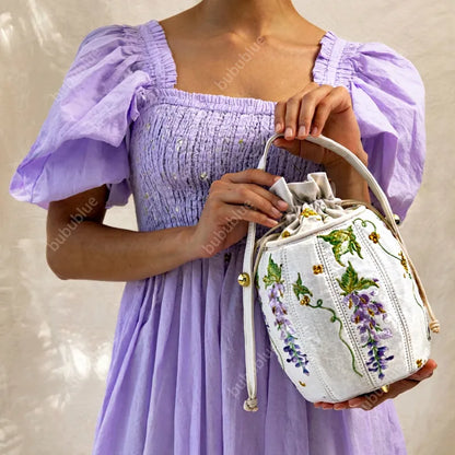 Wisteria Embroidered Drawstring Bucket Bag in Cream Satin