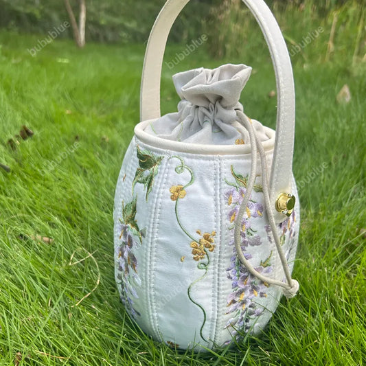 Wisteria Embroidered Drawstring Bucket Bag in Cream Satin