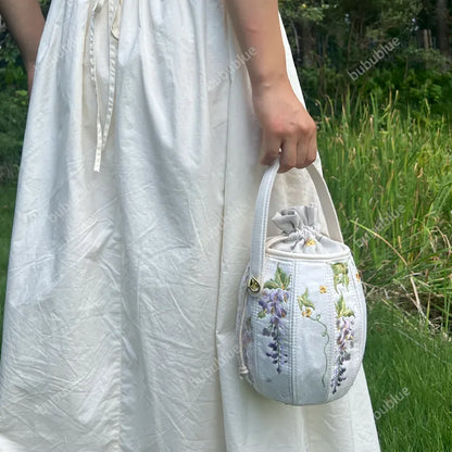 Wisteria Embroidered Drawstring Bucket Bag in Cream Satin