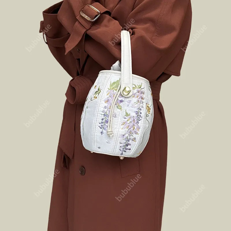 Wisteria Embroidered Drawstring Bucket Bag in Cream Satin