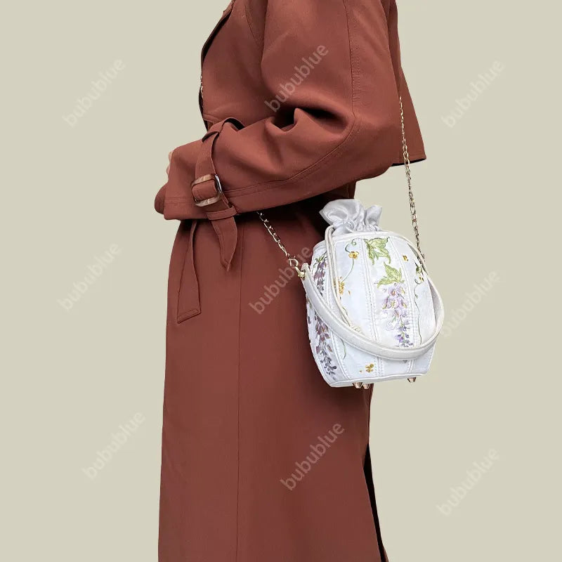 Wisteria Embroidered Drawstring Bucket Bag in Cream Satin