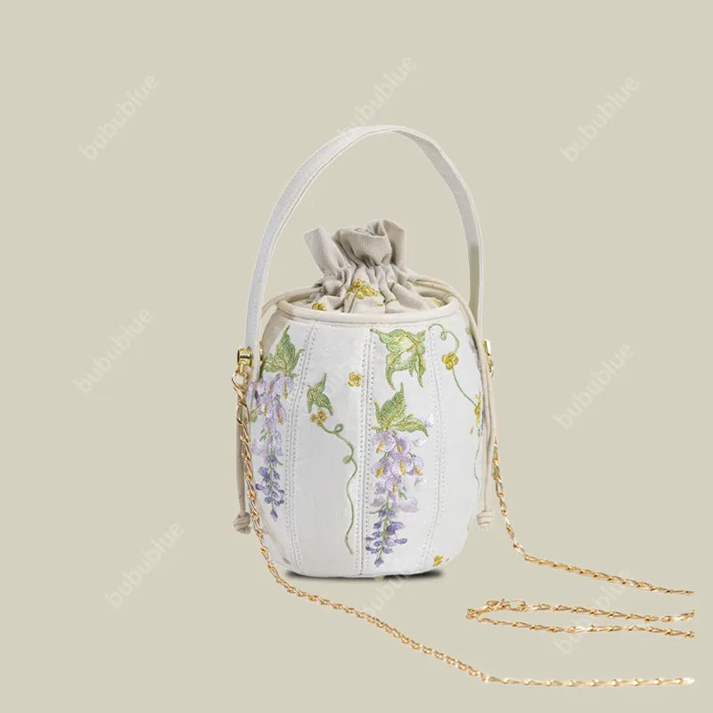 Wisteria Embroidered Drawstring Bucket Bag in Cream Satin