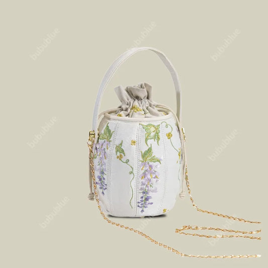 Wisteria Embroidered Drawstring Bucket Bag in Cream Satin