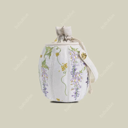 Wisteria Embroidered Drawstring Bucket Bag in Cream Satin